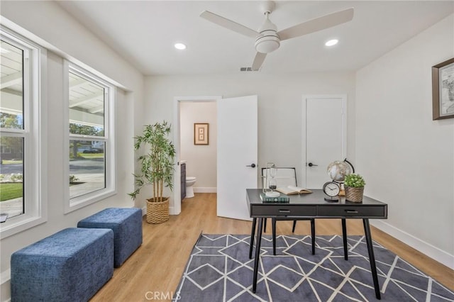 office area with ceiling fan and wood-type flooring