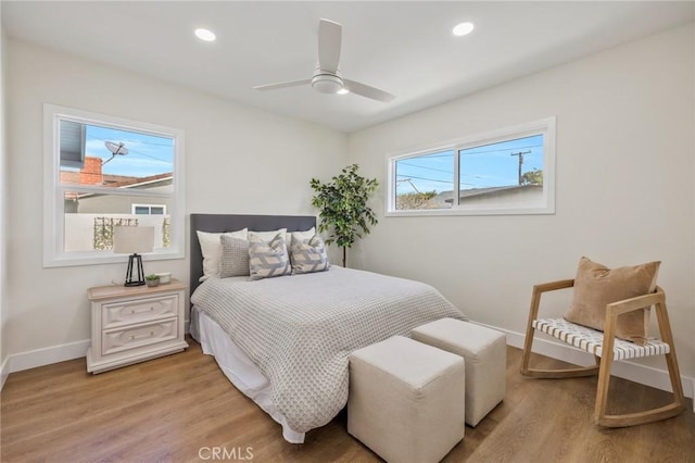 bedroom featuring light hardwood / wood-style floors and ceiling fan