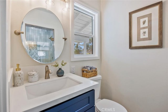 bathroom featuring toilet and vanity