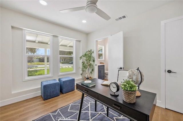 office space featuring hardwood / wood-style flooring and ceiling fan