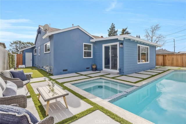 back of property with a patio and a swimming pool with hot tub