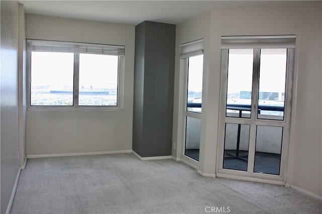 525 E Seaside Way Unit 1504, Long Beach, CA 90802 - carpeted empty room with baseboards