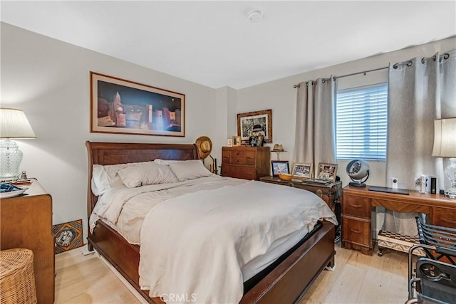 bedroom with light wood-type flooring