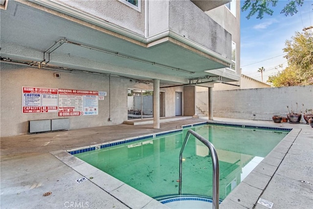 view of swimming pool with a patio area