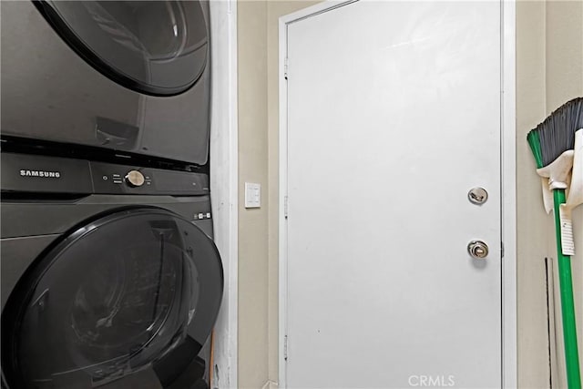 laundry room featuring stacked washer and dryer