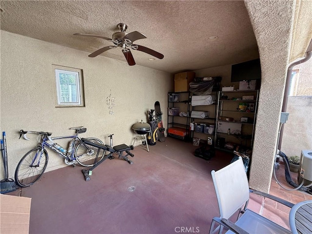 storage area featuring ceiling fan