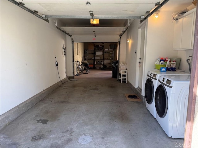 garage with washer and clothes dryer and a garage door opener