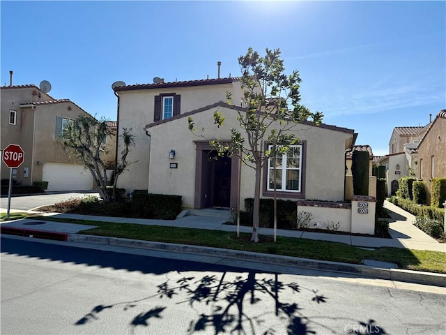 mediterranean / spanish-style house featuring a garage