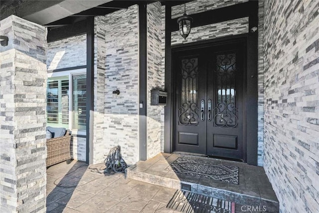 property entrance featuring french doors