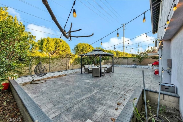 view of patio featuring outdoor lounge area and a gazebo