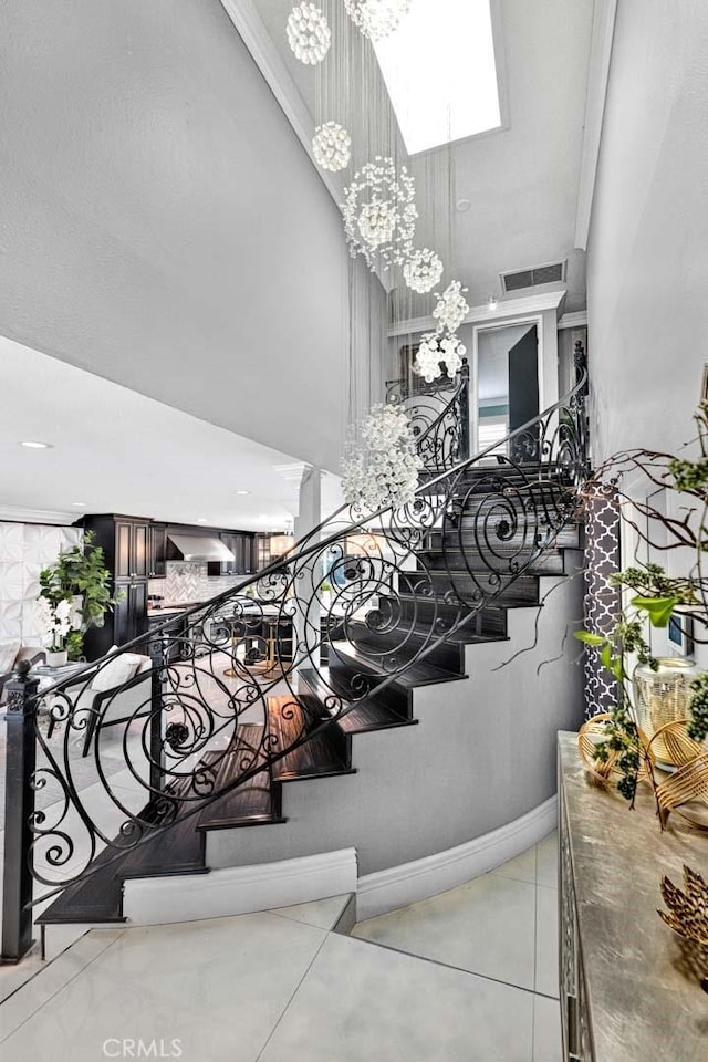 interior space with tile patterned floors and a chandelier