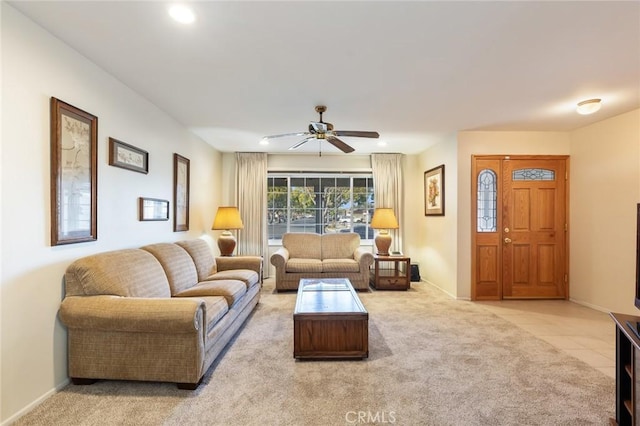 living room featuring light colored carpet and ceiling fan