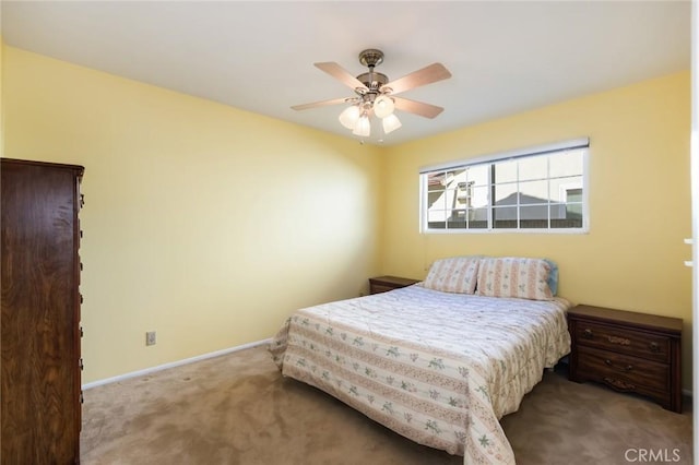 bedroom featuring ceiling fan and carpet floors