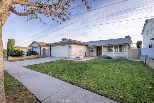 single story home featuring a garage and a front yard