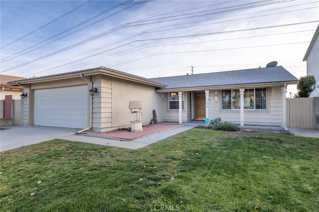 ranch-style home featuring a garage and a front yard