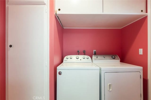 washroom with washer and dryer