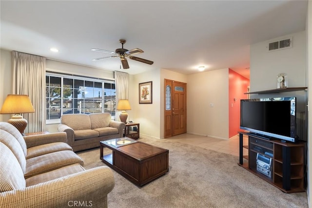 living room featuring light colored carpet and ceiling fan