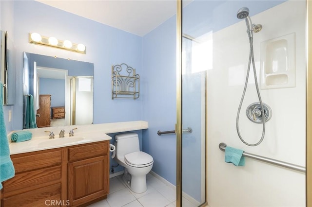 bathroom featuring vanity, toilet, an enclosed shower, and tile patterned flooring