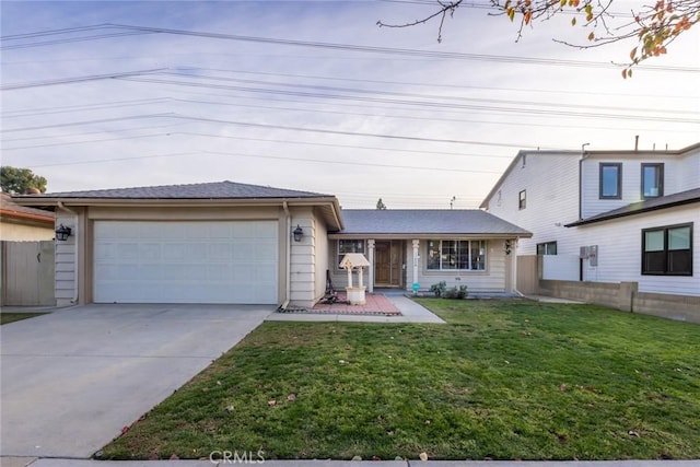 view of front facade with a garage and a front yard