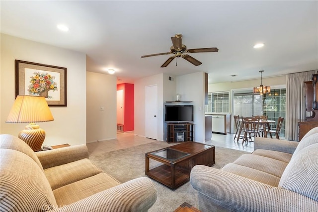 carpeted living room featuring ceiling fan