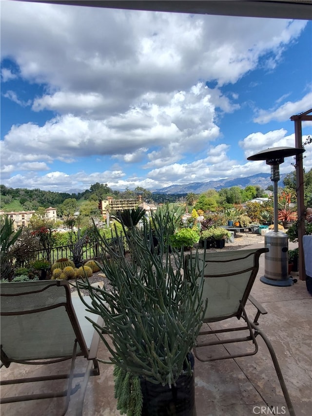 view of patio / terrace featuring a mountain view