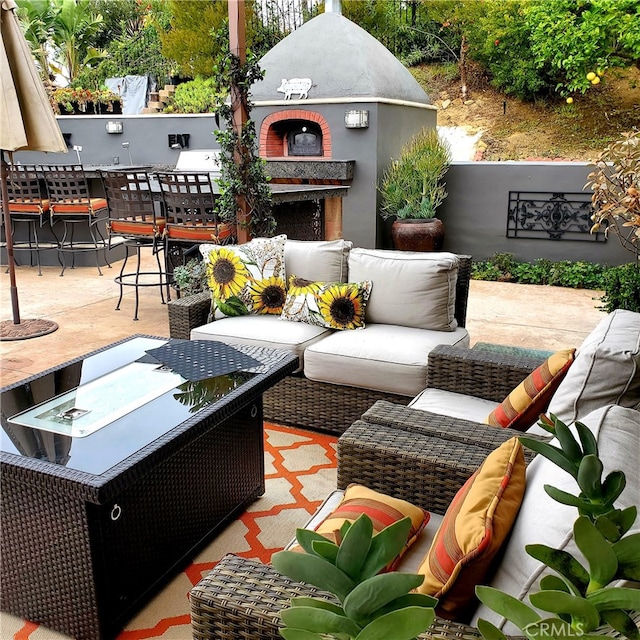 exterior space with an outdoor living space with a fireplace