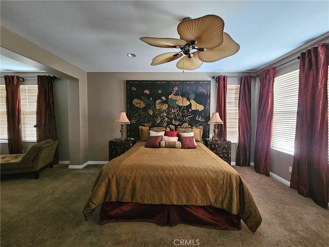 bedroom with carpet, baseboards, and ceiling fan