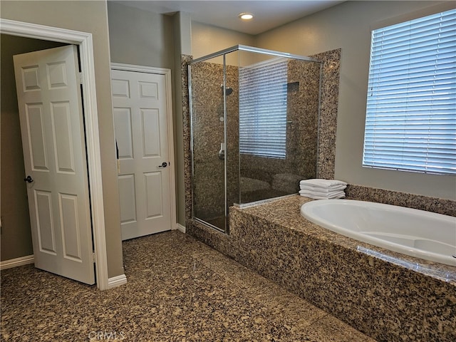 full bathroom with recessed lighting, a shower stall, a bath, and baseboards