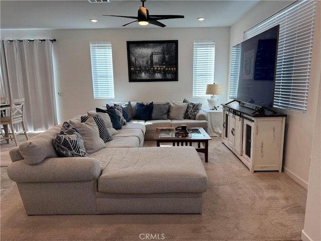 living area featuring ceiling fan, recessed lighting, light colored carpet, visible vents, and baseboards