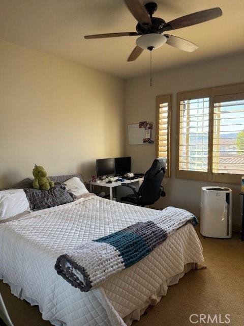 bedroom featuring ceiling fan and carpet flooring