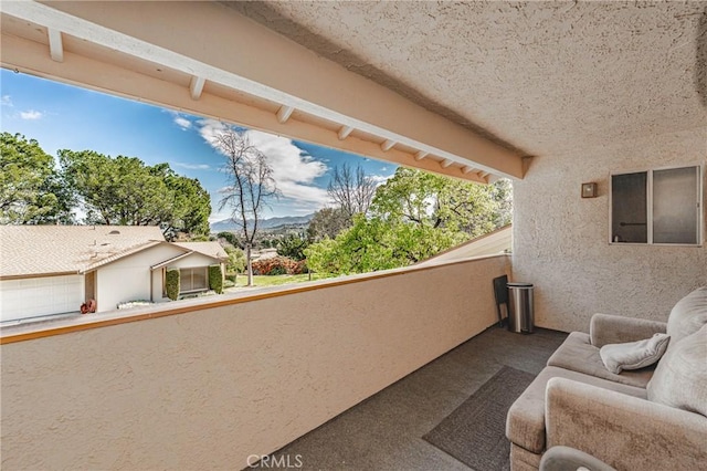 balcony featuring a mountain view