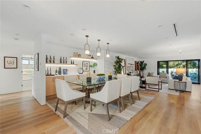 dining room with light wood-type flooring