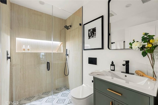 full bath with toilet, a shower stall, and vanity