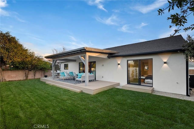 back of house with a yard, a patio area, and outdoor lounge area