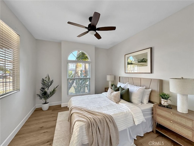 bedroom featuring ceiling fan and light hardwood / wood-style floors