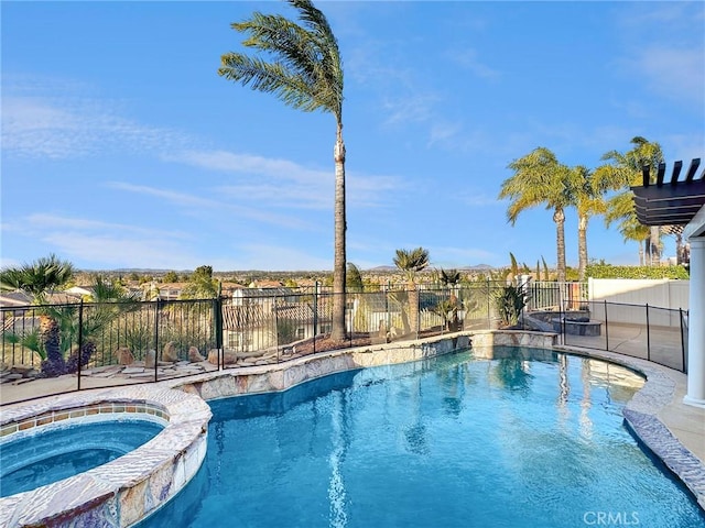 view of pool featuring an in ground hot tub