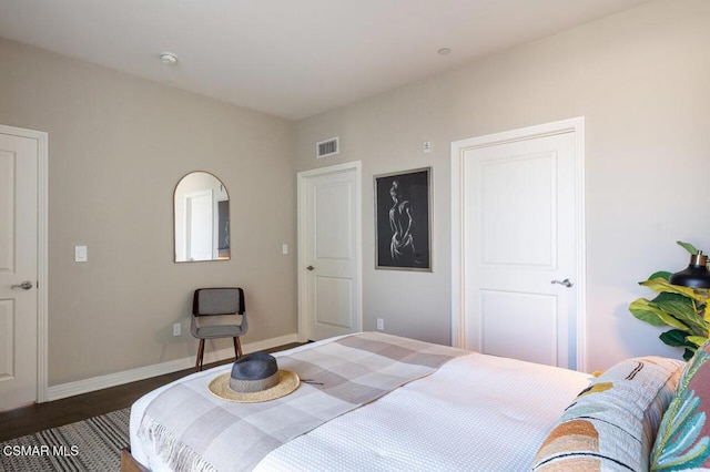 bedroom featuring dark hardwood / wood-style floors