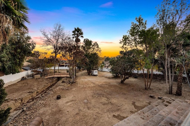 view of yard at dusk