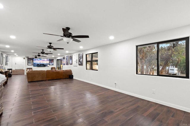 unfurnished living room with ceiling fan