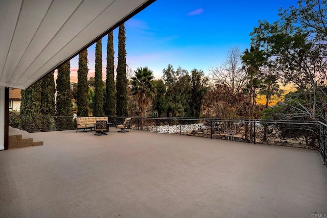 view of patio terrace at dusk