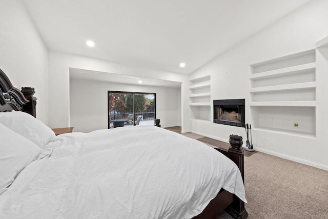 carpeted bedroom featuring lofted ceiling