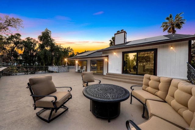 patio terrace at dusk with outdoor lounge area