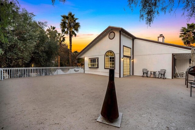 view of back house at dusk