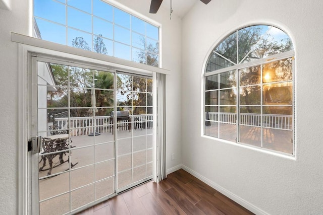 doorway to outside featuring ceiling fan