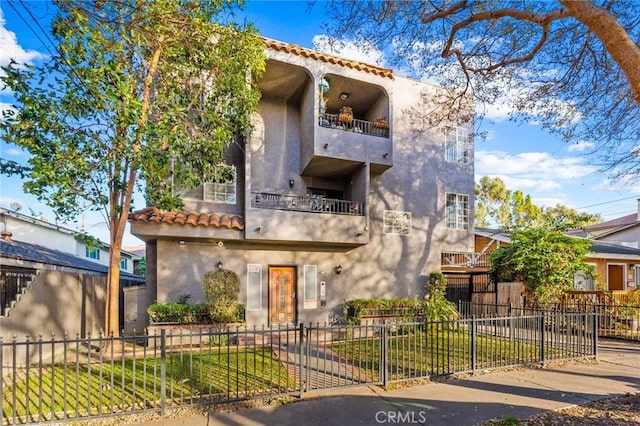 mediterranean / spanish home featuring a balcony