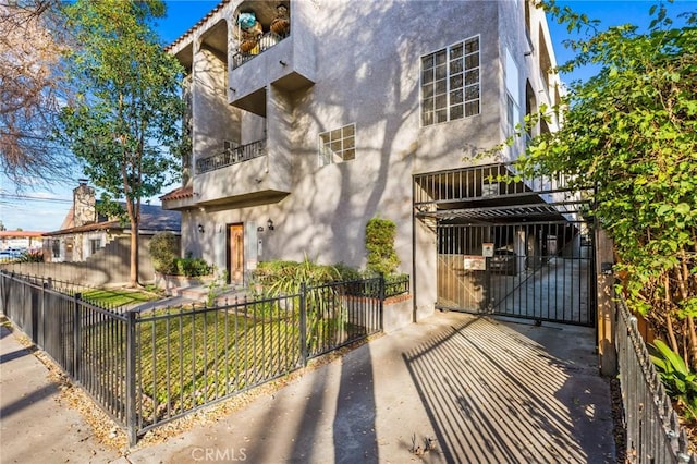 view of front of property with a balcony