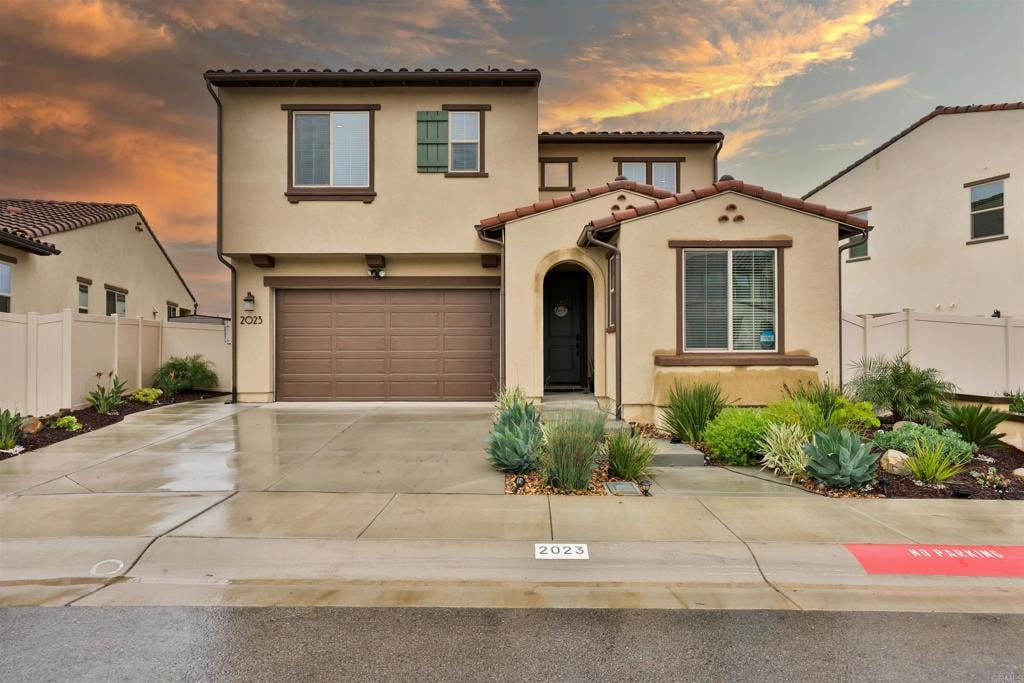 mediterranean / spanish-style house featuring a garage