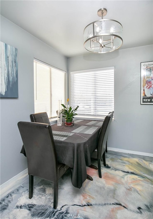 dining room featuring a chandelier