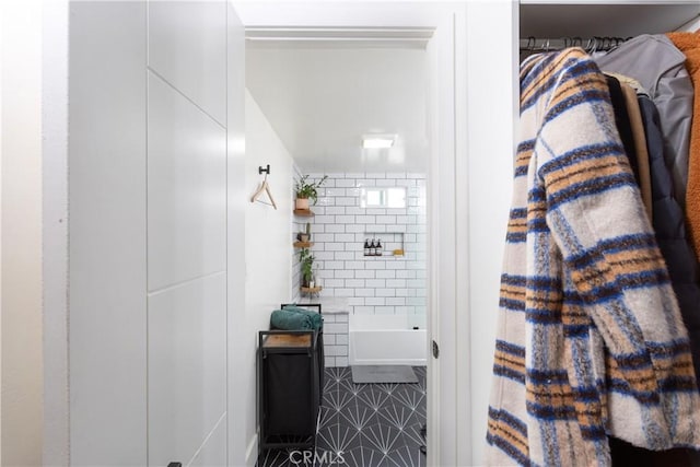 bathroom featuring tile walls, separate shower and tub, and tile patterned flooring