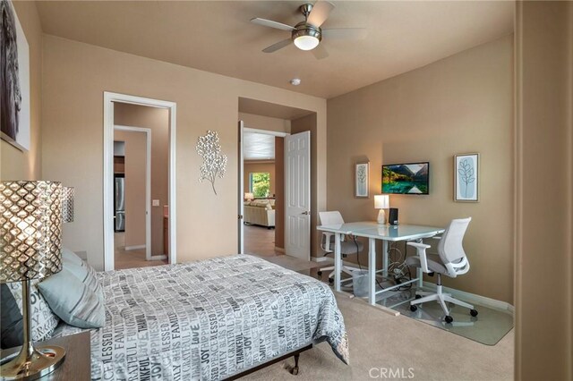 bedroom with light colored carpet and ceiling fan